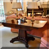 F10. Mahogany pedestal table with two drawers. 29”h x 56”w x 28”d 